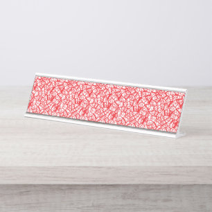 Red and orange wrapping paper with a geometric mot desk name plate