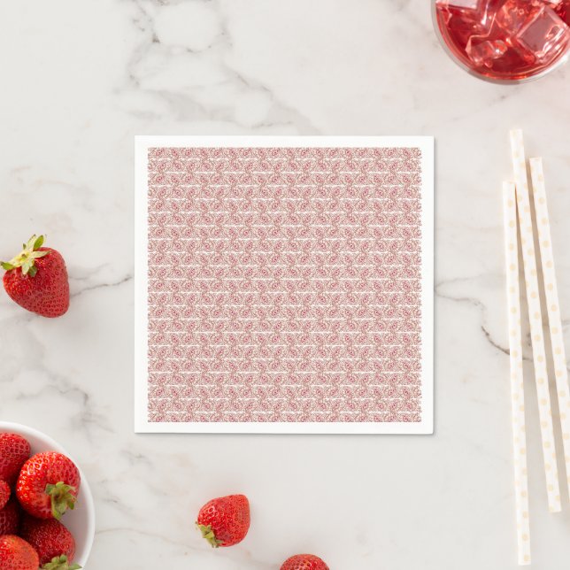 Red and pink textiles laid over a patterned rug wi napkin (Insitu)