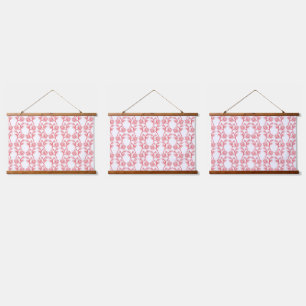 Red and pink wrapping paper featuring a repeating  hanging tapestry