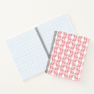 Red and pink wrapping paper featuring a repeating notebook