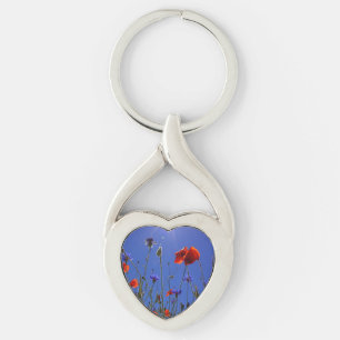 red and purple roses embracing a blue sky and sun key ring