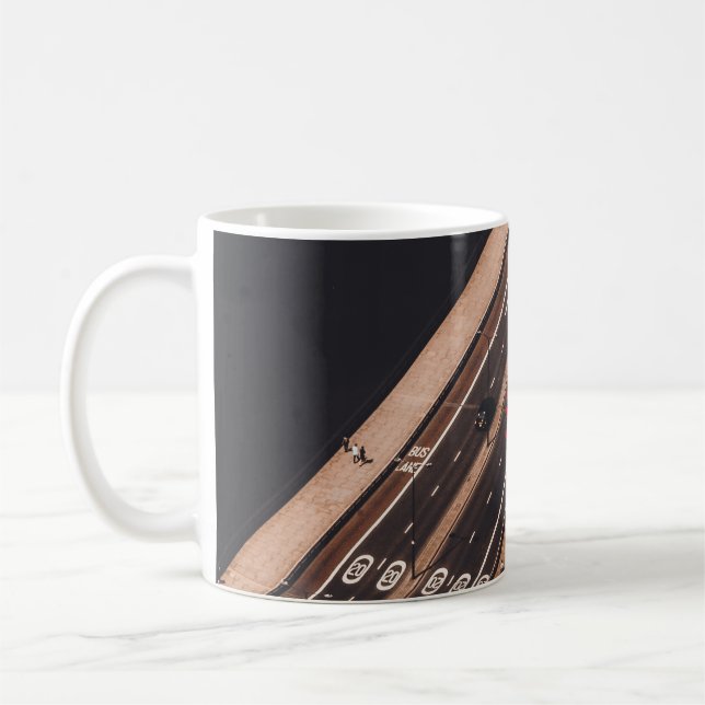RED AND WHITE BUS RUNNING ON BRIDGE COFFEE MUG (Left)