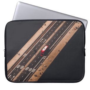 RED AND WHITE BUS RUNNING ON BRIDGE LAPTOP SLEEVE