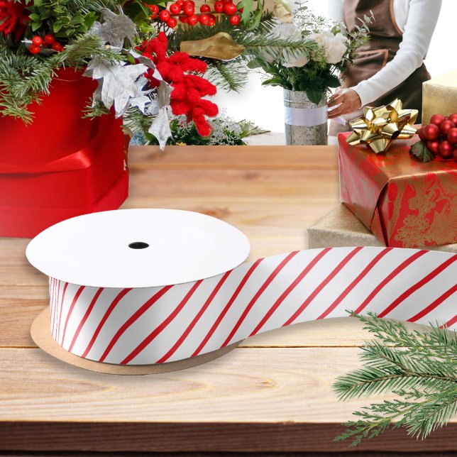 Red and White Candy Cane Diagonal Stripe Patterned Satin Ribbon (A roll of ribbon for festive gift wrapping and crafts, with red and white candy cane striped pattern)