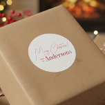 Red and White Christmas from Family Name Classic Round Sticker<br><div class="desc">Red Christmas design. Personalised with your family name. - Merry Christmas design in minimal, red and white with the message, "Merry Christmas! from the Johnsons". - Modern and stylish typography text templates ready for you to edit. - Ideal for your Christmas gift wrap, mailing accessories. envelope seals, and party favour...</div>