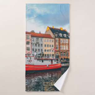 RED AND WHITE CONCRETE BUILDING BATH TOWEL