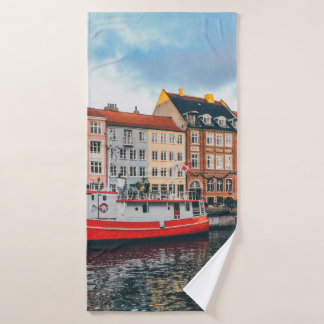 RED AND WHITE CONCRETE BUILDING BATH TOWEL