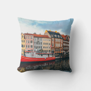 RED AND WHITE CONCRETE BUILDING CUSHION