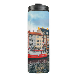 RED AND WHITE CONCRETE BUILDING THERMAL TUMBLER