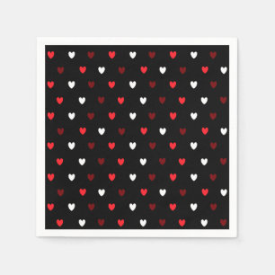 Red and white hearts on black napkin