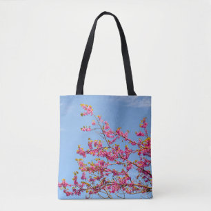RED AND YELLOW FLOWER UNDER BLUE SKY TOTE BAG
