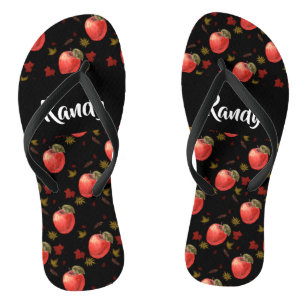 Red apples and leaves on black thongs