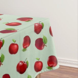Red Apples on Light Green Tablecloth