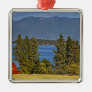 Red barn sits along scenic Flathead Lake near Metal Tree Decoration