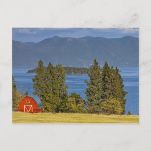 Red barn sits along scenic Flathead Lake near Postcard