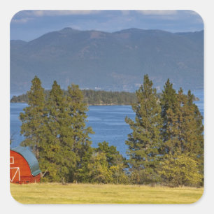 Red barn sits along scenic Flathead Lake near Square Sticker