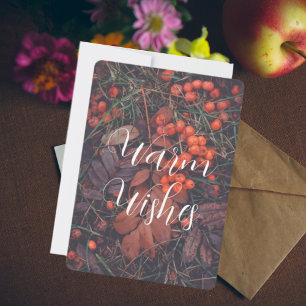 Red berries and brown autumn leaves holiday card