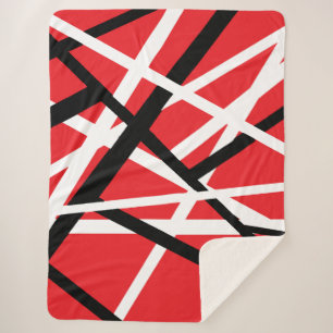 red, black, and white graphic sherpa blanket