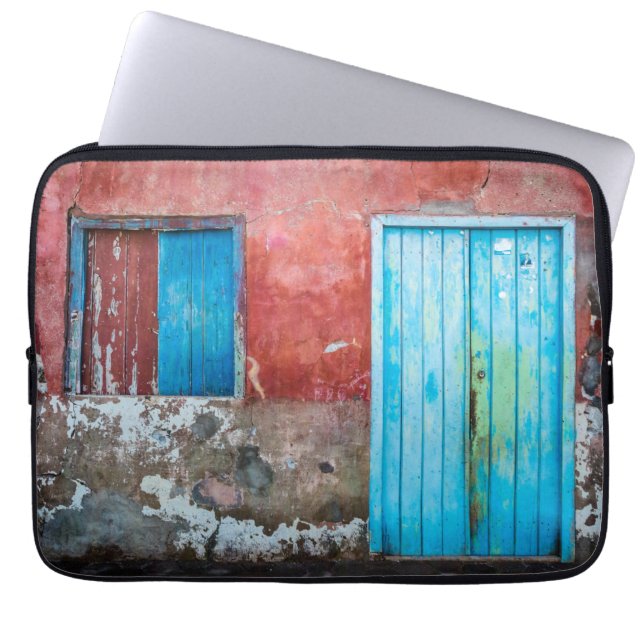Red, blue and grey wall, door and window laptop sleeve (Front)