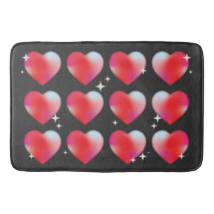 Red blur hearts and stars in black background bath mat