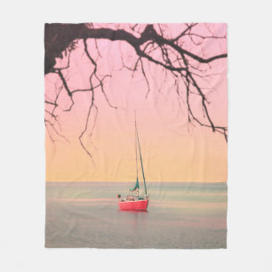 RED BOAT ON BEACH DURING SUNSET FLEECE BLANKET