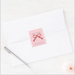 Red Bow Coquette Squiggly Borders Christmas  Square Sticker<br><div class="desc">This design features modern Christmas stickers with a soft pink background and a deep red hand-drawn bow. The elegant scalloped edges and oval photo frame make it the perfect choice for showcasing your favourite family photo. Personalise with your family's name and photo.</div>