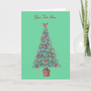 red bows and bells on decorated tree for christmas holiday card