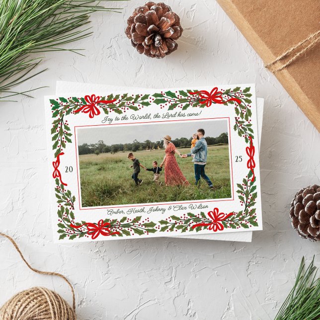 Red Bows and Holly Garland One-Photo Christmas Holiday Card (Charming holly branches and red looping bows frame one horizontal photo Christmas holiday card)