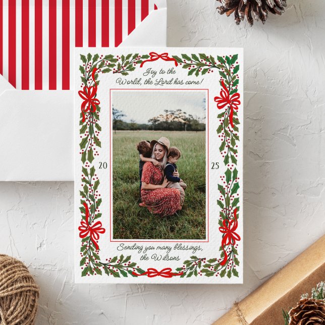 Red Bows and Holly Garland One-Photo Christmas Holiday Card (festive holly garland and red bows surround a family portrait photo on this modern Christmas card)