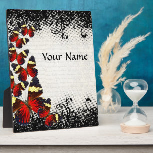 Red butterflies on black lace plaque