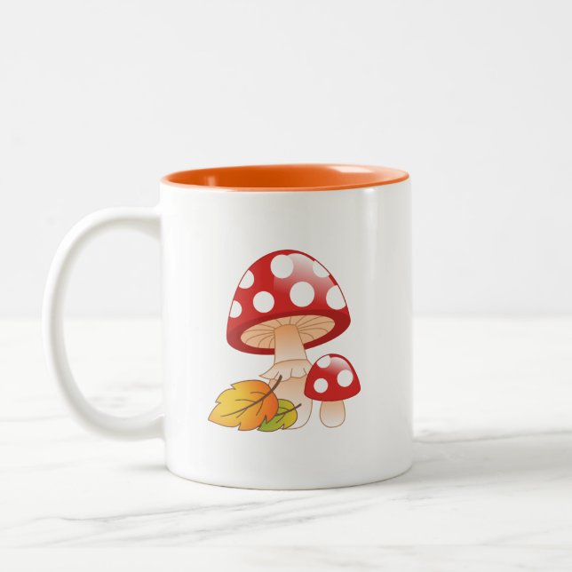 Red Cap Toadstool Mushrooms and Leaves Two-Tone Coffee Mug (Left)