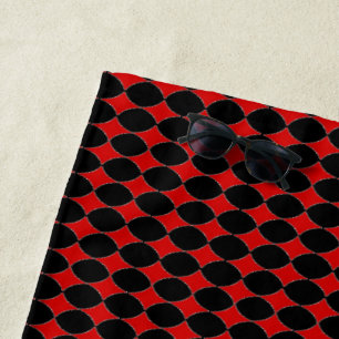 Red card diamonds on black beach towel