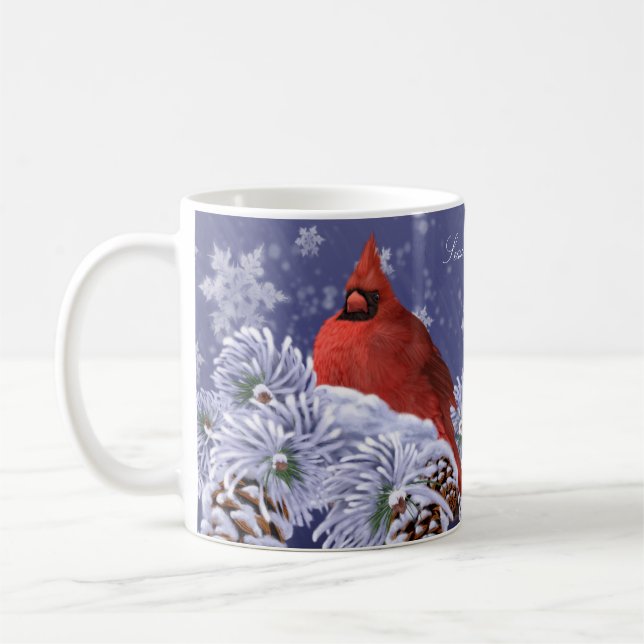 Red cardinal nestled upon snow covered spruce tips coffee mug (Left)