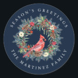Red Cardinal Pine Wreath Season's Greetings Classic Round Sticker<br><div class="desc">Add a special touch to your envelopes or gift giving. Designed to coordinated with the Elegant Christmas Wreath and Cardinal collection. A red cardinal is nestled in a traditional pine wreath decorated with berries,  pinecones and flowers. Greeting is written above and your name below.</div>
