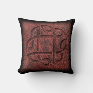 Red celtic knot embossed on leather cushion