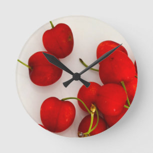 Red Cherries in Natural Light Lay on White Round Clock