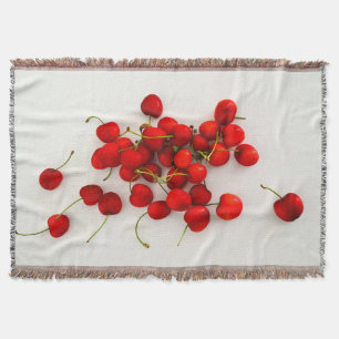 Red Cherries in Natural Light Lay on White Throw Blanket
