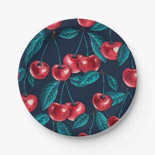 Red cherries on dark blue paper plate