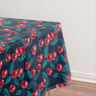 Red cherries on dark blue tablecloth