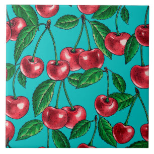 Red cherries on turquoise ceramic tile