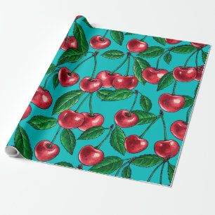 Red cherries on turquoise wrapping paper