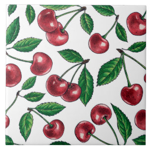 Red cherries on white ceramic tile