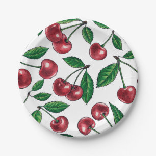 Red cherries on white paper plate