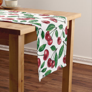 Red cherries on white short table runner