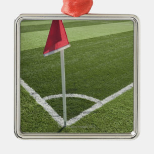 Red corner flag on soccer field metal tree decoration