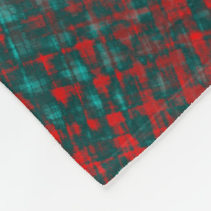 Red crisscrossing scratches over charred cyan fleece blanket