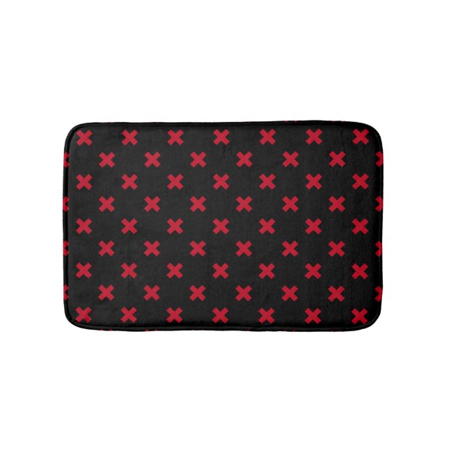 Red cross stitches on black bath mat (Front)