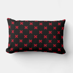 Red cross stitches on black lumbar cushion