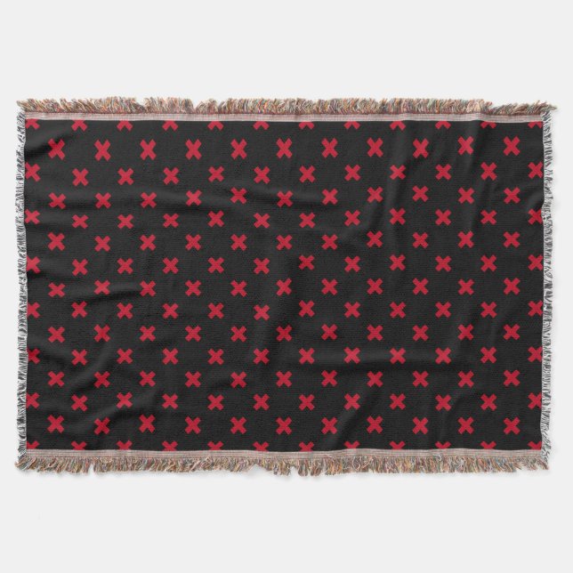 Red cross stitches on black throw blanket (Front)