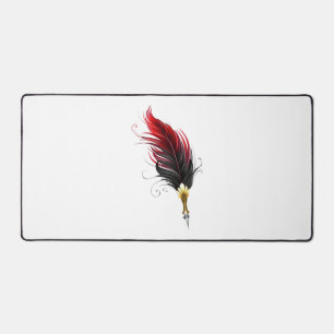 Red feather pen with gold nib desk mat